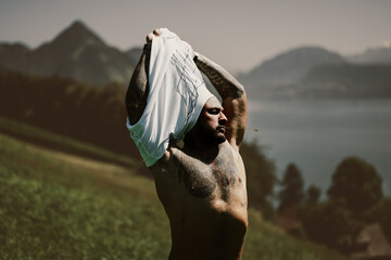 Sexy man posing outdoor on nature background. Man sexy. Handsome naked muscular man. Seductive guy....
