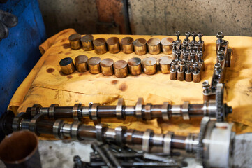 Steel cogs, details, equipment used by workers, repairmen. Engineers, mechanics working in garage,...