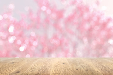 木目のある木製のテーブル越しに見えるボケた背景、奥行きのある背景、桜の背景画像 - obrazy, fototapety, plakaty