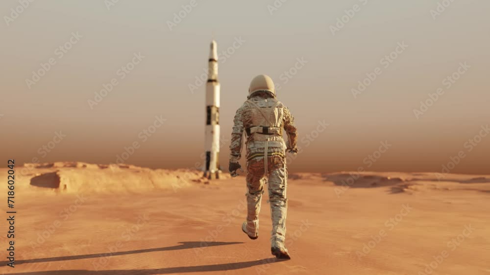 Wall mural astronaut walking on the surface of planet mars in space