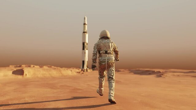 Astronaut walking on the surface of planet Mars in space