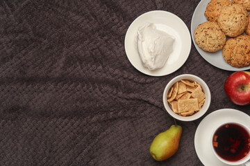 Breakfast in bed. Food on a dark blanket. Top view