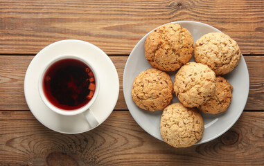 Cup of tea and cereal cookies on the table