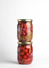 Pickled Canned tomatoes in glass jars on white background