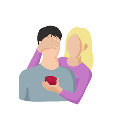 blonde woman hugs brunette man closing his eyes with one hand and holding a small red box in front of him with the other. Concept woman proposes marriage to man, woman gives gift to man