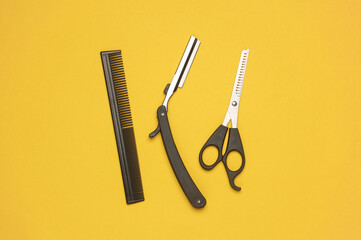 Barber working tools on a yellow background. Layout. Flat lay. Top view