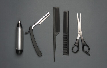 Barber working tools on dark gray background. Layout. Flat lay. Top view