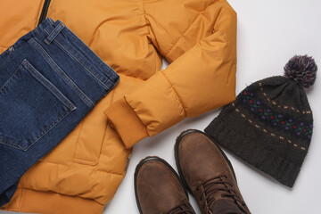 Set of men's winter clothes on a white background. Top view