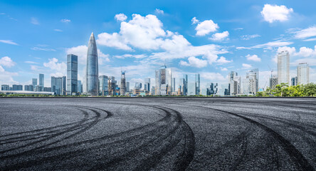 Empty asphalt road and city buildings skyline in Shenzhen