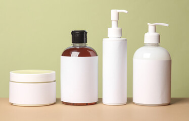 Bottles of cosmetics on a green background