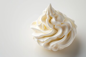 Whipped cream swirling on white background
