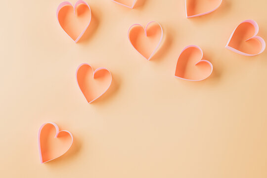 Top view flat lay pink ribbon heart shaped decorative symbol on pastel background, love romance concept, template banner design with copy space, Mother, Women's day, Happy Valentines Day