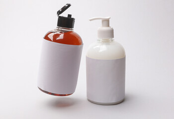 Floating soap bottles on a white background