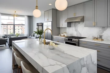 Deurstickers A stylish kitchen in Chicago with gold hardware, stainless steel appliances, and white marbled granite counters. © Prasanth