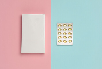 White Box of pills on blue pink background - obrazy, fototapety, plakaty