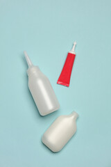 Tubes for hair dyeing on a pastel background