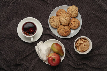 Breakfast in bed. Food on a dark blanket. Top view