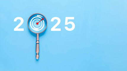 magnifying glass shows target 2025, action business plan for the new year's growth. concept of...