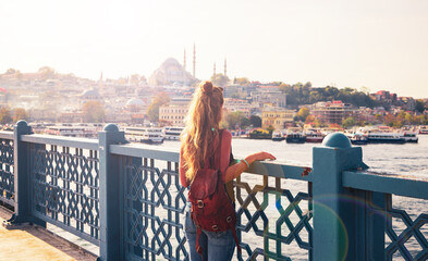 Woman tourist enjoying sunset view of Istanbul city- Travel, tourism, destination in Turkey