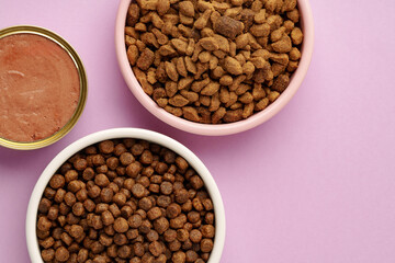 Cat food on pink background in studio