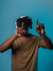 Immersed in a digital realm, an African American man navigates the virtual landscape with a VR...