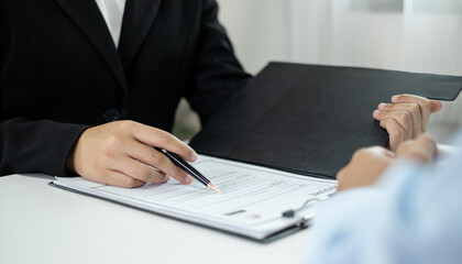 Business people hold a resume and talk to job applicants for job interviews about careers and Their personal history in the company. Recruitment concepts