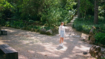 Peaceful tourist enjoy green beautiful forest trees standing recreation place. 