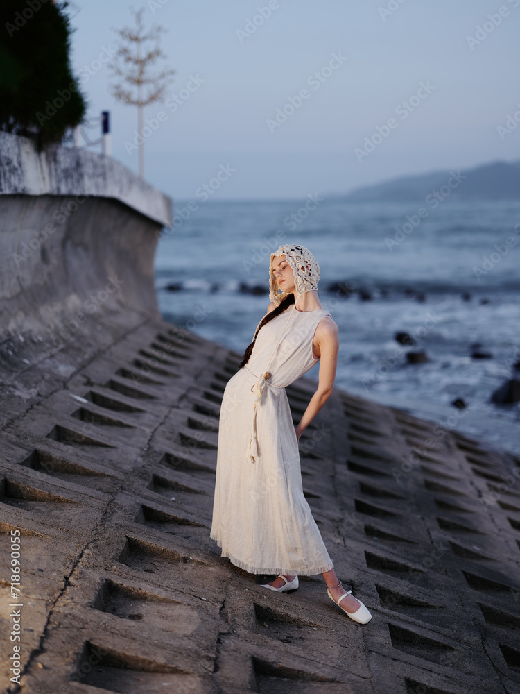 Poster Summer Beauty: Young White Lady in a Blue Dress, Enjoying Vacation at the Beach with Ocean View