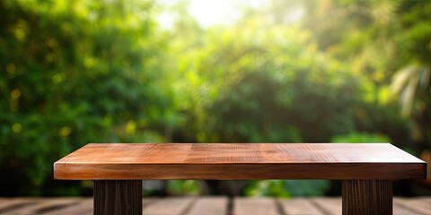 Fototapeta premium Vertical wooden table with blank space for your product or advertising text against blurred natural background.
