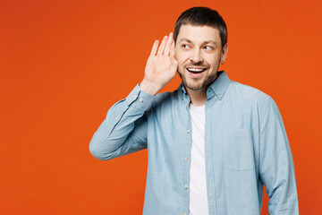 Young curious nosy smiling man he wears blue shirt white t-shirt casual clothes try to hear you...