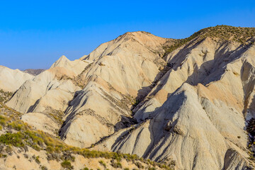 Dramatic Eroded Mountain Formations at Dusk