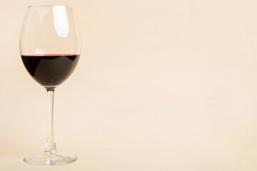 One glasses of red wine at wine tasting. Concept of red wine on colored background. Top view, flat lay design