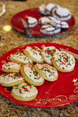 Festive Christmas Cookies on Red Plate with Holiday Decor Background
