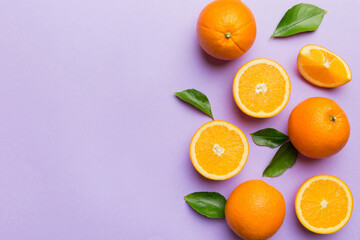 fresh Fruit orange slices on colored background. Top view. Copy Space. creative summer concept. Half of citrus in minimal flat lay with copy space