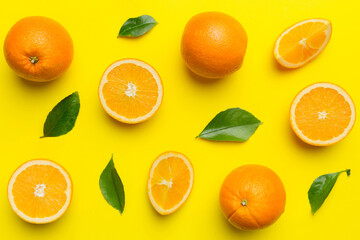 Fruit pattern of fresh orange slices on colored background. Top view. Copy Space. creative summer concept. Half of citrus in minimal flat lay