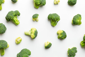 green fresh broccoli background close up on colored table. Vegetables for diet and healthy eating. Organic food