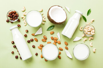 Set or collection of various vegan milk almond, cashew, on table background. Vegan plant based milk...