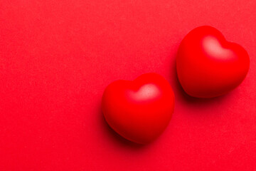 red heart shape on colored background. minimal concept top view with copy space