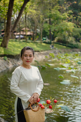 Portrait of Vietnamese woman in white ao dai outdoor