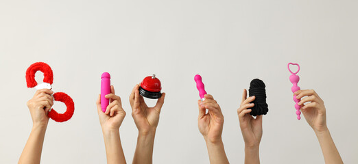 Intimate toys for adults in the hands of women.