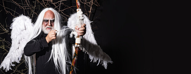 Halloween people in angel costume. Angel man with feather white wings and gift. Horned Devil in his...