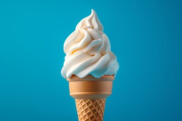 Delicious creamy white vanilla ice cream cone on a blue background