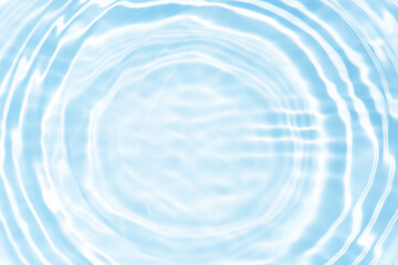 Bluewater waves on the surface ripples blurred. Defocus blurred transparent blue colored clear calm water surface texture with splash and bubbles. Water waves with shining pattern texture background.