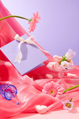 Marshmallow on a glass pedestal, a pastel purple card with a pretty silk bow and fresh flowers...