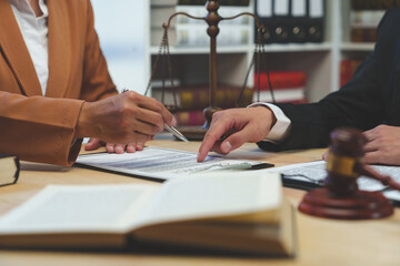 Lawyer, legal advisor, Asian businessman explaining agreement details Business contracts to investors and brainstorming Take notes for accuracy in the document before signing the contract together.
