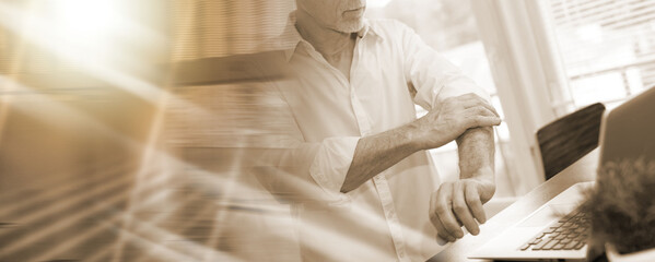 Businessman rolling up his sleeves; multiple exposure