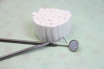 Dental instruments and swabs on a napkin