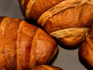 tasty delicious croissants and coffee cappuccino cup with hearts from milk foam in cafe, french...