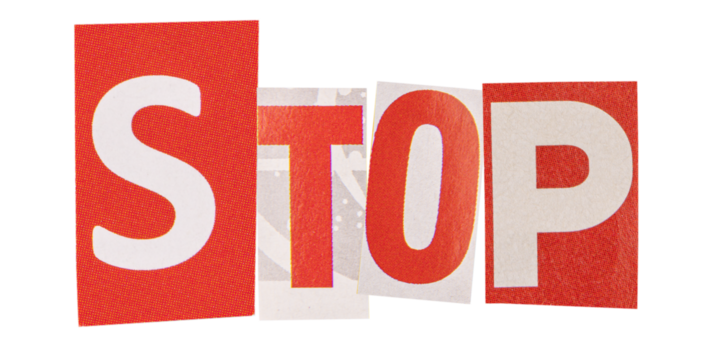 The word stop made from cut out letters