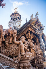 Fototapeta na wymiar Sanctuary of Truth wooden temple in Pattaya Thailand is a gigantic wood construction located at the cape of Naklua Pattaya City. Sanctuary of Truth temple. 